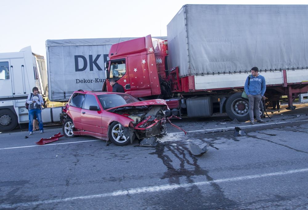 Car collides with truck